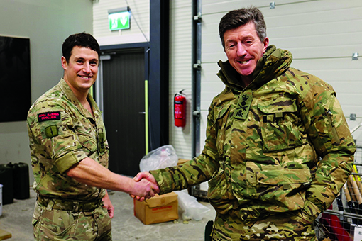 CGRM awarding CSgt Lister with a coin in recognition of his hard work throughout Winter Deployment